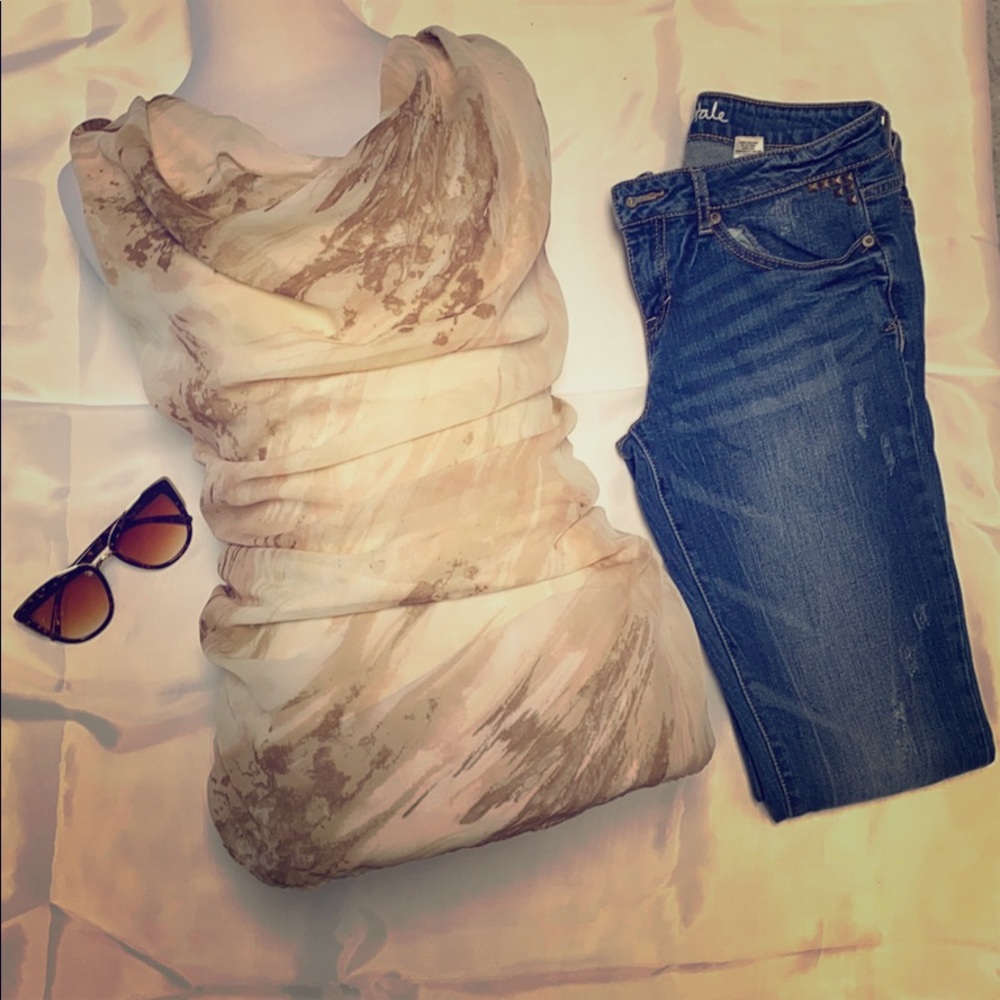 Jennifer Lopez flowing cowl neck tank top.